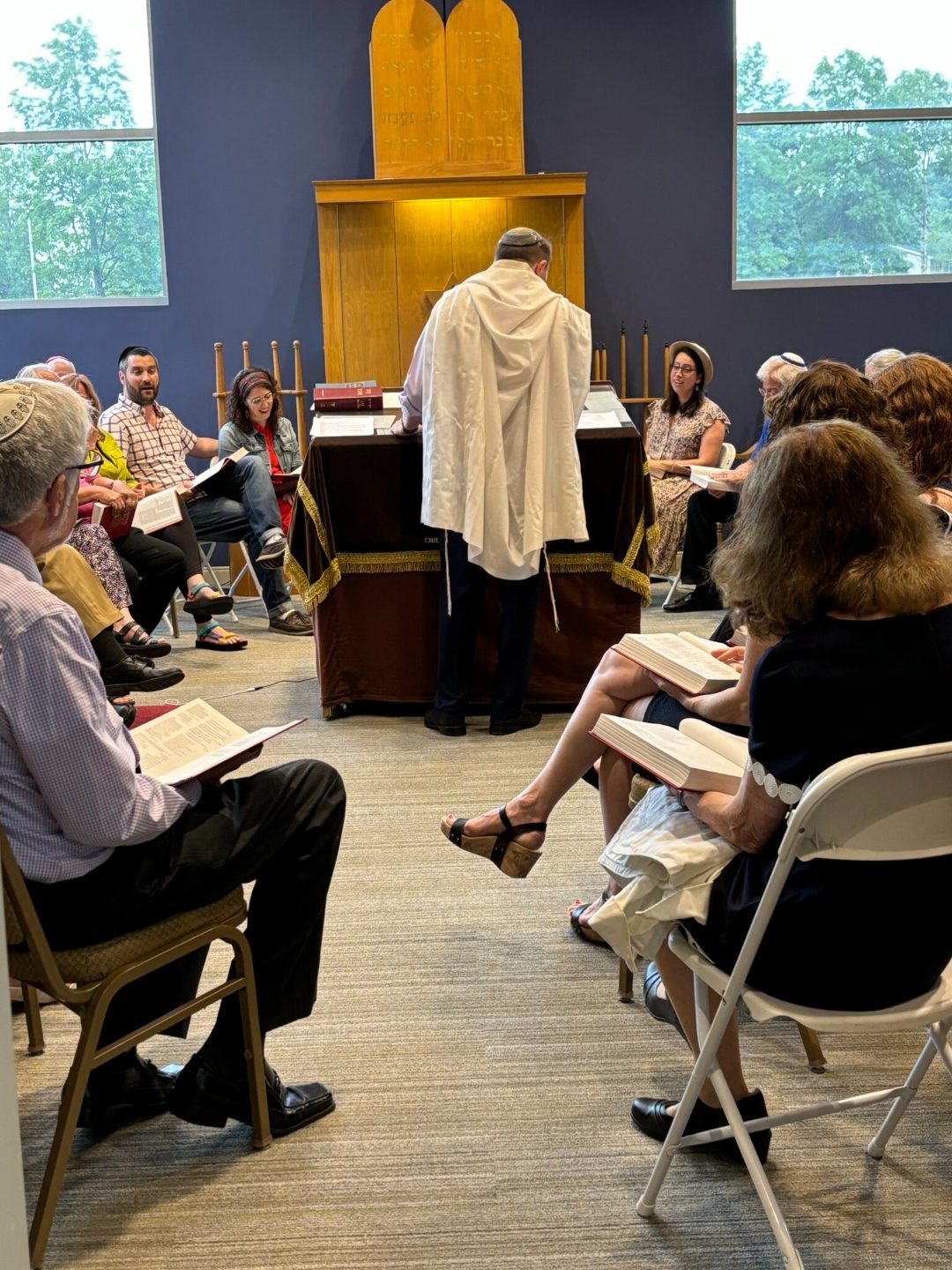 Rabbi Micah Friedman leading prayer in the Temple Israel sanctuary.